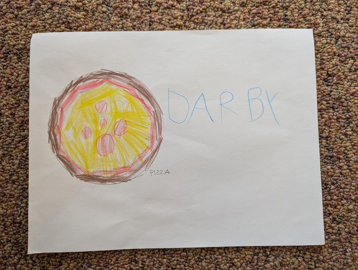 A child's drawing of a whole pizza labeled 'pizza', signed 'DARBY'